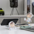 Cell Stand Hands-free Active Poses Astronaut Phone Holder. 