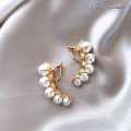Golden Arc Pearl Climber Earrings – Luxury Curve Collection by Golicc. 
