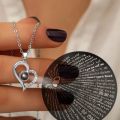 Eternal Affection Stainless Steel Heart Pendant Necklace with 100 Languages I Love You Display. 