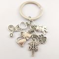 1pair veterinary key ring charm stethoscope animal protective gear animal dog cat nurse key chain veterinary jewelry gift. 