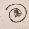 The Hunger Games Catching Fire Antique Bronze Necklace. 