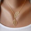 Creative Simple Double Gold Leaf Pendant Necklace Women's Trend Punk Tassel Chain Pendant Fashion Ladies Party Jewelry Gifts. 