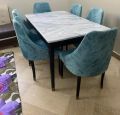 four seater dinig table set, marble top textured dinig table top, valvet up. 