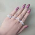 Set of 5 White Beaded Rings. 