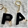 Initial keychain- Black and golden-  fancy keychain- Resin-  Epoxy - Matt Black Color. 