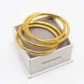 golden pellated 4 pcs jali zigzag bangles. 