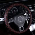 STEERING WHEEL COVER WITH RED STICHING/ RED THREAD DESIGN. 