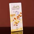 LINDT SWISS CHOCOLATE WHITE ALMOND 100 GM. 