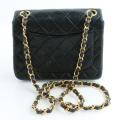 Chanel Black Quilted Lambskin Mini bag. 