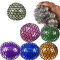 Pack of 4 - Assorted Colors Glitter Mesh Squishy Balls. 