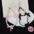 Korea ins pearl bow ribbon mobile phone chain lanyard versatile black and white hanging ornament small fragrance wind beaded pendant. 