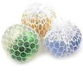 Pack of 4 - Assorted Colors Glitter Mesh Squishy Balls. 