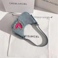 denim Shoulder bag Trendy blue Crescent moon bag Denim underarm bag for Evening events Night out Fashion shows Celebrities Fashion enthusiasts. 