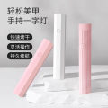 Handheld nail art lamp, small portable nail art light, ultraviolet quick-drying mini light therapy lamp, nail chip sticking diamond baking lamp. 