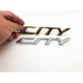 Honda Gold/Chrome City rear gold emblem logo. 