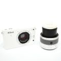 Nikon J1 Mirrorless Camera with 10-30 mm lens - White. 