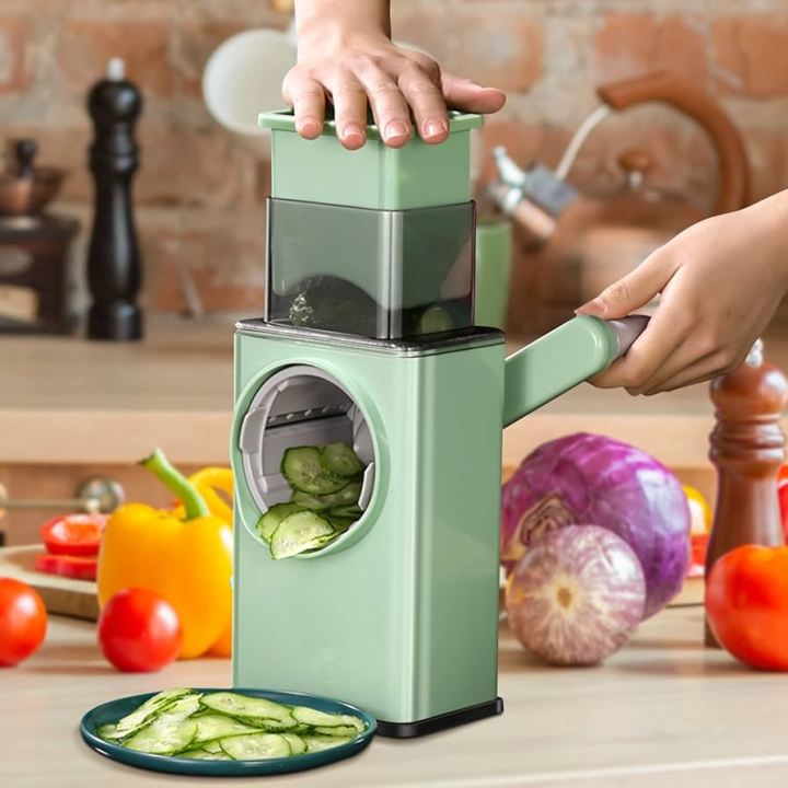 3-in-1%20Manual%20Drum%20Vegetable%20Cutter%20&%20Slicer%20%E2%80%93%20Multifunctional%20Rotatory%20Cheese%20Grater,%20Shredder,%20Peeler%20,salad%20maker%20&%20Chopper%20for%20Vegetables,%20Fruits,%20Nuts%20%E2%80%93%20Handheld%20Tabletop%20Kitchen%20Gadget%20(Kaddu%20Kash%20Machine)"%20-%20Image%204