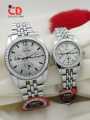 CD COLLECTION COUPLE WATCHES METALLIC CHAIN AND CUT CASE WITH PUSH BUTTON LOCK DIFFERENT COLOURS AVAILABLE WITH FREE BOX. 