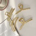 The Hair Edit Gold French Twist Claw Clip. 