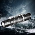 TG06S flashlight with battery and charging slot. 