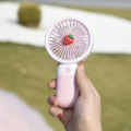 Convenient and ultra-quiet USB mini handheld wind power fan with portable phone holder student office small cooling fans. 