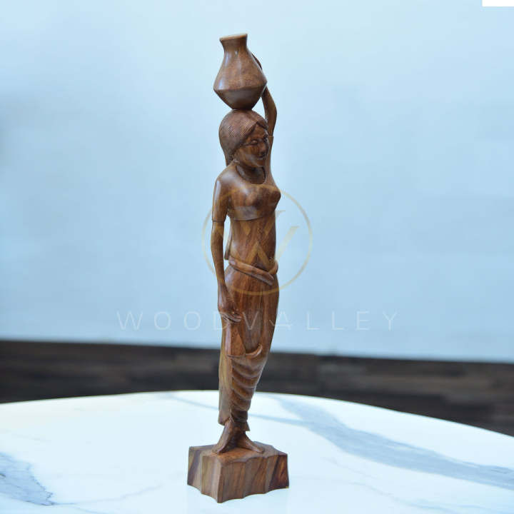 Wooden%20Hand%20Carved%20Native%20Women%20Cultural%20Sculpture-Wooden%20Woman%20Figurine%20Statue%20Hand%20Carved%20Tribal%20Art%20Sculpture-Folk%20Art%20Teak%20Wood%20Sculpture%20Hand%20Carved%20Native%20Woman%20Carrying%20Water%20-%20Image%202