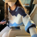 Contrast striped sweater for women with a lazy and loose soft long sleeved knitted top. 