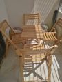 Beach Wood 4 Folding Chair and One Square Folding Table. 