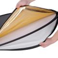Photography with the 43"/110cm 5-in-1 Collapsible Light Reflector - Multi-Disc Round Kit with Bag, Featuring Translucent, Gold, Silver, Black, and White Surfaces for Versatile Studio and Outdoor Lighting. 