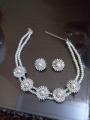 Stylish Zircon set with white pearls for women. 