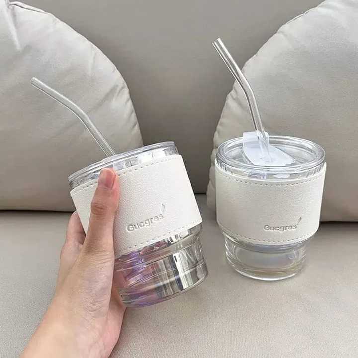 Tumbler%20Mug%20with%20Lid,%20Glass%20Straw%20and%20Protective%20Anti-Skid%20Leather%20Sleeve%20for%20Hot%20and%20Cold%20Beverages%20Tea%20Coffee%20Smoothies%20Fruit%20Juice%20Travel%20Mug%20.435ml%20-%20Image%209