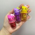 Hello Kitty keychain Color changing Glitter lip gloss. 