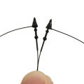 Black pointed mother button rubber clothing trademark hang tag thread hand threading needle plastic hanging rope. 