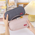 Nexvix Korean version simple hand-carried double-layer pencil case, oxford cloth solid color student stationery box, multi-function pencil case logo. 