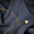 Golden Pendant with White Heart and Infinity Symbol - Elegant Women's Jewelry. 