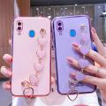For Samsung Galaxy A20 Back Cover with Love Heart Chain Wrist Strap Fashion Bracelet Shiny Plating Bumper Protective Case Silicone Shockproof Mobile Phone Cases. 