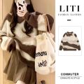 Contrast striped sweater for women with a lazy and loose soft long sleeved knitted top. 