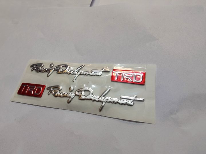 (2pcs)%20TRD,%20Red%20and%20Silver%20Silicon,%20Monogram,%20Sticker%20for%20Bikes,%20Cars,%20etc%20High%20Quality%20Silicon%20Stickers%20Silicon%20Coated%20-%20Image%205