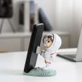 Cell Stand Hands-free Active Poses Astronaut Phone Holder. 