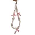Korea ins pearl bow ribbon mobile phone chain lanyard versatile black and white hanging ornament small fragrance wind beaded pendant. 
