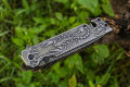 Foldable pocket knife with a scorpion pattern. 