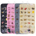 Efficient Hanging Jewelry Organizer with Embossed Pattern and 28 Clear PVC Pockets: Organize Your Jewelry in Style. 
