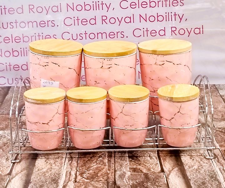 7-Piece Airtight Ceramic Canister Set with 3 Large and 4 Small Canisters on Metal Rack