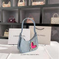 denim Shoulder bag Trendy blue Crescent moon bag Denim underarm bag for Evening events Night out Fashion shows Celebrities Fashion enthusiasts. 