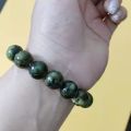 chengli Yaowang stone natural active magnetic single circle bracelet serpentine Tibetan jade olive green meteorite graphite green jade bracelet. 