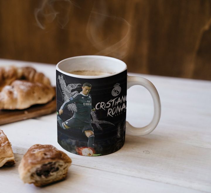 "Cristiano Ronaldo Celebration Mug: Relive the Glory of Every Goal – Perfect for fans, this striking mug captures the essence of CR7's electrifying celebrations, making it an essential addition to your collection for enjoying your favorite drinks!"