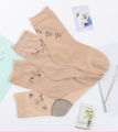 There are middle-aged and elderly women's cotton bottom stockings in the tube mother's socks mother-in-law summer thin belt heels wear-resistant flesh-colored socks. 