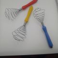 egg mixer- stainless steel egg mixer with plastic handle. 