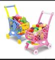Toy shopping cart with baby toys. 