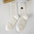 Medium socks women's winter thick small fragrance embroidery camellia cashmere socks ins tide black and white wool socks wholesale. 